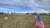 Local high school students line schoolyard with 1,000 flags to honor veterans
