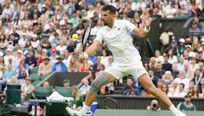 Novak Djokovic wins his first match at Wimbledon with a sleeve on his surgically repaired knee