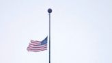 Why are flags flying at half-staff in Wisconsin today?