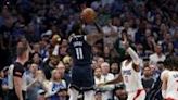 Kyrie Irving of the Dallas Mavericks takes a three-point shot over ...Los Angeles Clippers in game six of their NBA Western Conference first-round playoff series