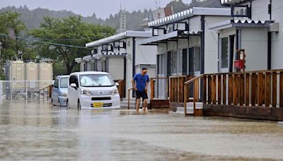 Rescue workers search for at least 6 people missing after heavy rain pounds Japan’s Noto region