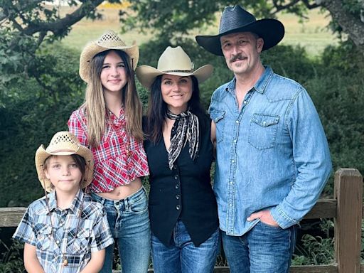 Tiffani Thiessen rocks a cowboy hat and vest in rare family photo