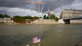 An American swims in Paris' Seine River before the Olympics despite contamination concerns