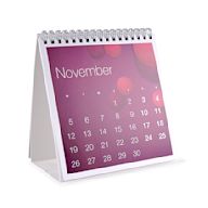 A small calendar that sits on a desk or table Often includes a stand or holder Can be flipped or torn off to reveal a new page for each day or week