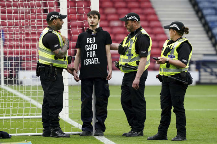 Protestor chains himself to a goalpost ahead of Scotland-Israel women's match