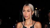 Kim Kardashian looks completely naked with Rapunzel length hair wrapped around her body