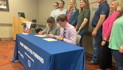 Four Columbia high school students sign as registered youth apprentices with businesses