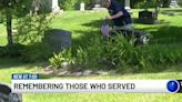 Community members place flags on veterans’ graves to honor them for Memorial Day