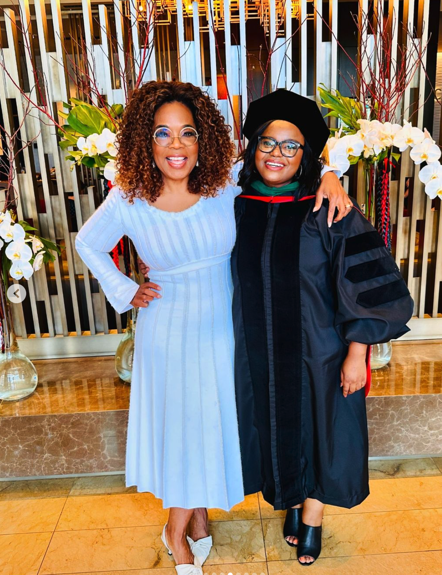 Oprah celebrates one of the first students at her South Africa school earning her doctorate