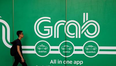 Grab's deal to buy Singapore taxi firm might lessen competition, regulator says