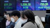 Asian shares mixed as investors eye Tokyo inflation data
