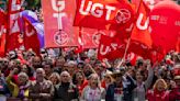 Workers around the world hold May Day rallies urging greater rights and more pay