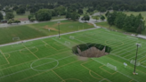 Security cam captures moment giant sinkhole swallows football pitch in Illinois