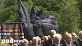 Inflatable sculpture carried to Penrhyn Castle in procession