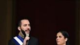 El Salvador's President Nayib Bukele, accompanied by his wife Gabriela Rodriguez, addressed the crowd after being sworn in at the National Palace in downtown San Salvador