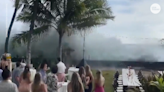 Huge waves hit Hawaii in 'historic' swell; surf crashes into homes, wedding party, videos show