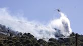 Two wildfires are burning near Greece’s capital, fueled by strong winds