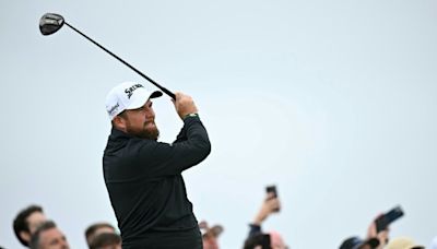 Lowry takes British Open lead, Woods, McIlroy battle to make cut