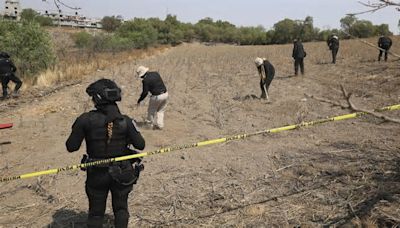 Clandestine burial pits, bones and children's notebooks found in Mexico City, searchers say