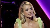 Carrie Underwood Causes a Commotion After Wearing a Fan's Jacket During Her Concert