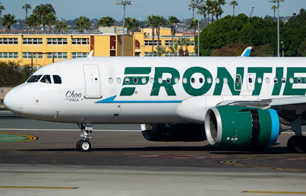 A Frontier passenger sat in an exit row was escorted off the plane in handcuffs after seemingly saying she wouldn't help in an emergency