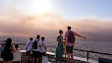 Greek wildfires produce 700km smoke cloud stretching across southern Europe