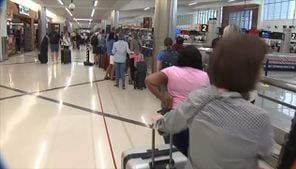 Stranded passengers in ‘every nook and cranny’ of Atlanta airport after global IT outage