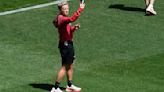 Canada women's soccer coach will step aside for the team's opener because of drone incidents