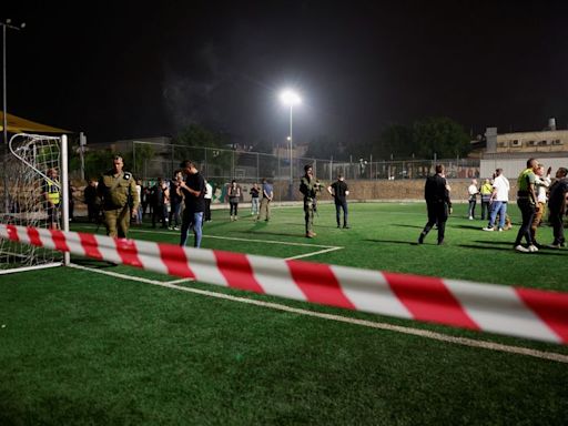 Israel says Hezbollah rocket kills 11 at football ground, vows response