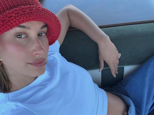 Pregnant Hailey Bieber Shares Peek at Her Bare Bump in Denim Overalls: 'Summer So Far'