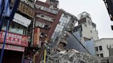 Earthquake aftershocks halt the demolition of a leaning building in Taiwan. Death toll rises to 13