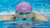 Qin Haiyang of China sets a world record in the men's 200-meter breaststroke at world championships