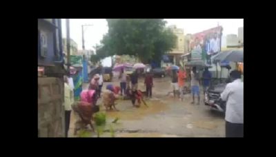 Frustrated by potholes, Telangana residents plant rice in them to demand action. Watch