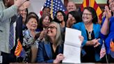 Arizona governor signs a bill to repeal 1864 ban on most abortions