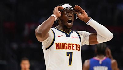 Guard Reggie Jackson traded from Denver Nuggets to Charlotte Hornets with three second-round picks
