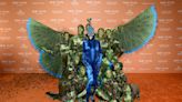 Heidi Klum is unrecognisable as she transforms into a peacock for her most elaborate Halloween costume yet