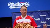 Hot dog eating champion banned from contest after vegan deal