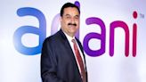 Adani Group’s profit drops 11% in March quarter; here’s what analysts say on Adani stocks