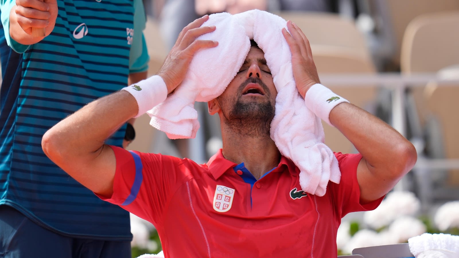 Djokovic wins his 1st Olympic gold medal by beating Alcaraz in men's tennis final