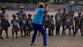 Baseball becomes a shelter for Venezuelan children in soccer-mad Peru