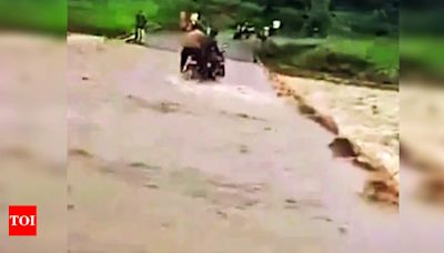 Biker washed away in gushing C’wara river, rescued by villagers | Bhopal News - Times of India