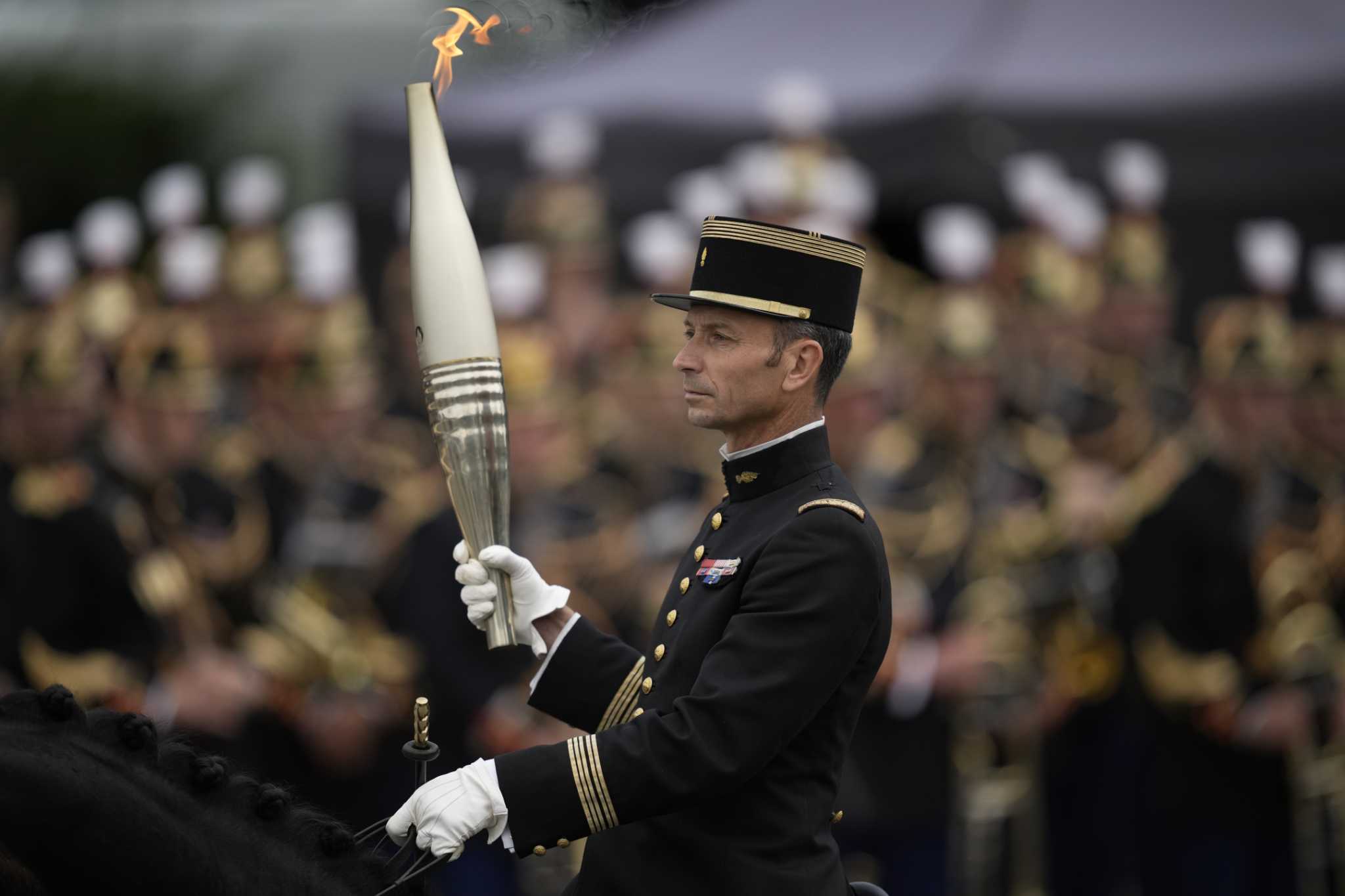 France's Bastille Day parade meets the Olympic torch relay in an exceptional year