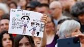 Young fans held up drawings depicting Nemo as Biel celebrated the Eurovision winner in the old town's Burgplatz