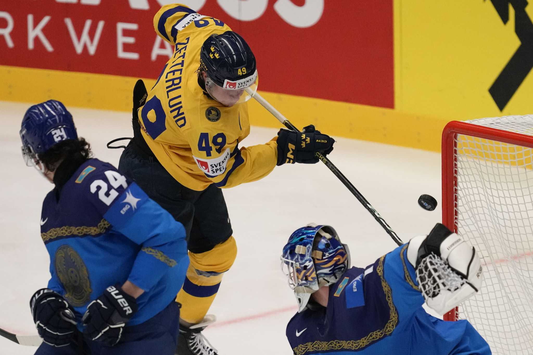 Sweden beats Kazakhstan to keep perfect record at hockey worlds, Austria upsets Finland