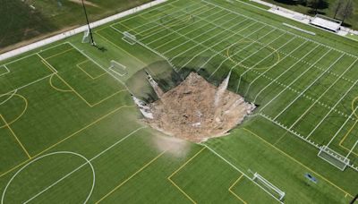 Giant sinkhole swallows middle of Illinois football field