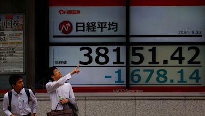 Asia stocks slide, oil extends gains on Middle East risks