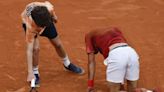 Novak Djokovic wins his record 370th Slam match but isn't sure he can continue at the French Open :: WRALSportsFan.com