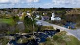 A village in Maine is again delaying a plan to build the world's tallest flagpole