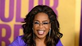 See why Oprah Winfrey looks ‘VERY HAPPY’ with who she’s sitting next to at the Golden Globes