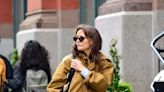 Katie Holmes’s Mustard Brown Trench Is the Perfect Coat for Waiting Out Summer